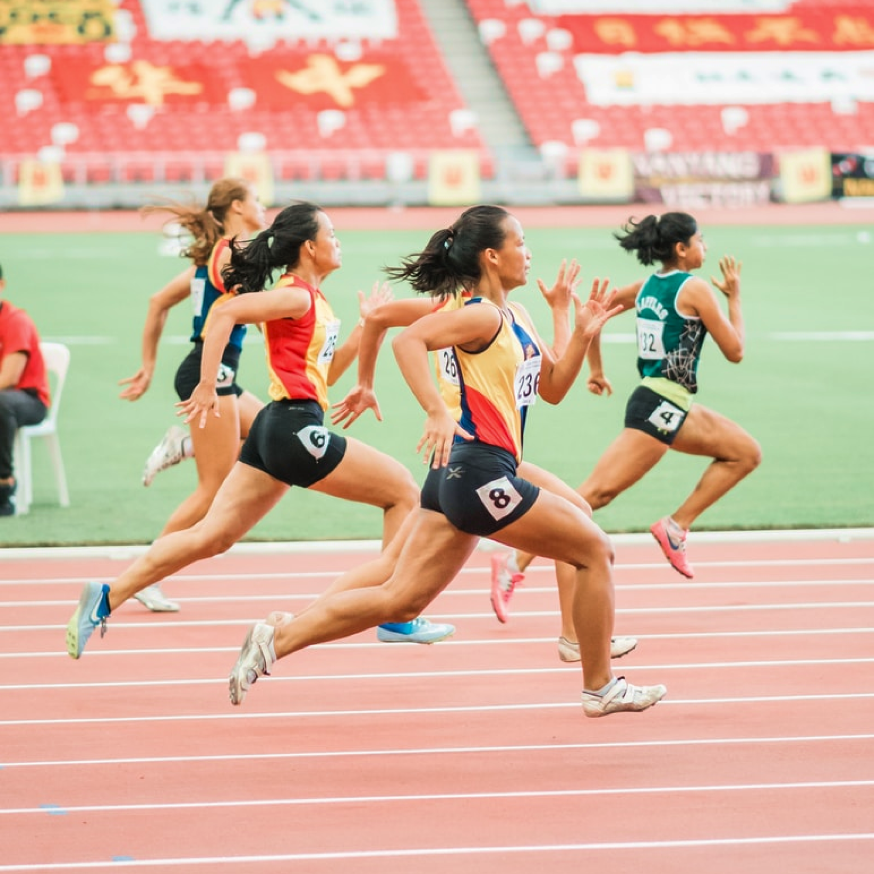 Track athletes running a race.